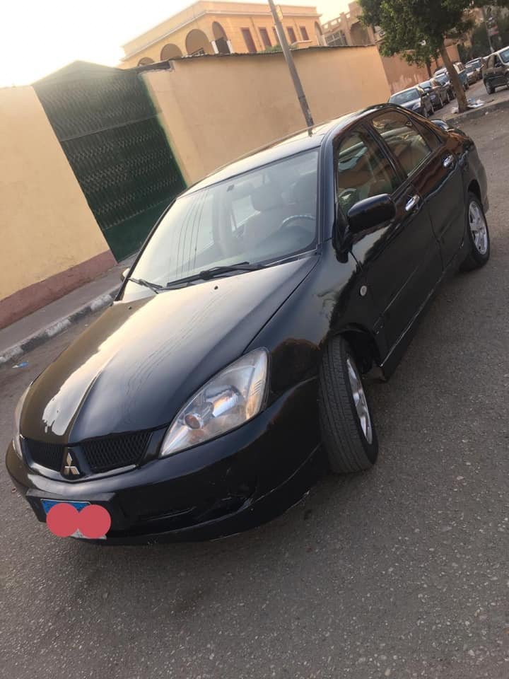 لانسر ٢٠٠٩ اكشن فريكه حاله ممتازه جدا ١٦٠٠ سي سي