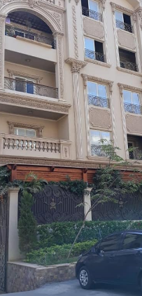 شقة للبيع دور ارضي مرتفع بالنرجس عمارات